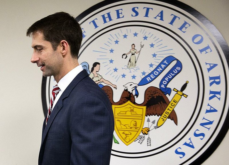 U.S. Sen. Tom Cotton ends a session with photographers Wednesday at his office on Capitol Hill. Cotton’s spokesman Caroline Rabbitt said interview requests have poured into the office since Monday. 