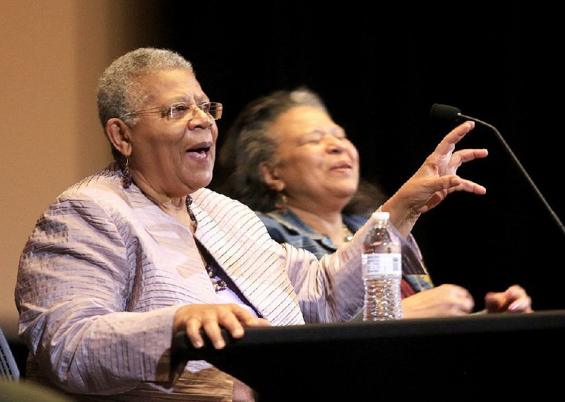 Minnijean Brown Trickey (left) and her sister, Phyllis Brown, speak Saturday at the Ron Robinson Theater about their experiences during the integration of Little Rock public schools. 