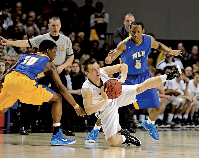 The Sentinel-Record/Mara Kuhn EFFECTIVE PRESSURE: North Little Rock's Kevaughn Allen, left, and Adrian Moore defend as Bentonville's Trenton Carter falls to the court during the Class 7A boys state final Saturday at Bank of the Ozarks Arena. Allen's game-high 28 points led NLR to a 66-59 win before at sellout crowd of 6,500.