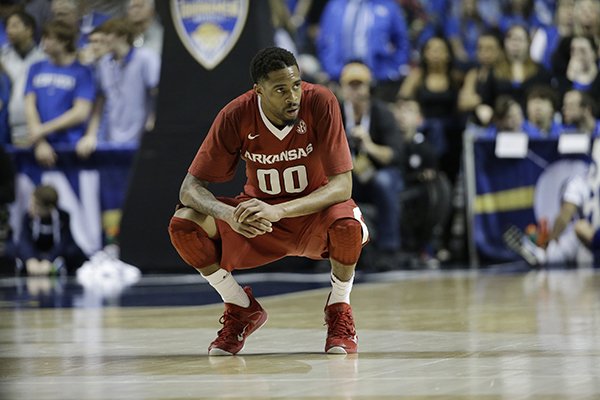 Arkansas guard Rashad Madden (00) takes a break on the court during the second half of the NCAA college basketball Southeastern Conference tournament championship game against Kentucky, Sunday, March 15, 2015, in Nashville, Tenn. (AP Photo/Mark Humphrey)