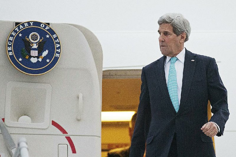 U.S. Secretary of State John Kerry disembarks from his plane as he arrives in Geneva, Switzerland, Sunday March 15, 2015. Kerry is in Geneva to resume talks with Iranian officials to limit Tehran's most sensitive nuclear activities for at least 10 years in exchange for the gradual easing of some sanctions.  (AP Photo/Brian Snyder, pool)