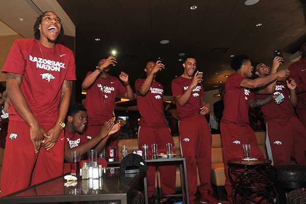 Arkansas players celebrate their NCAA Tournament selection Sunday in Nashville, Tenn. 