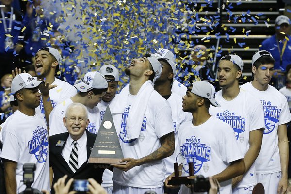 Kentucky forward Willie Cauley-Stein holds the trophy after the NCAA college basketball Southeastern Conference tournament championship game against Arkansas, Sunday, March 15, 2015, in Nashville, Tenn. Kentucky won 78-63. (AP Photo/Steve Helber)