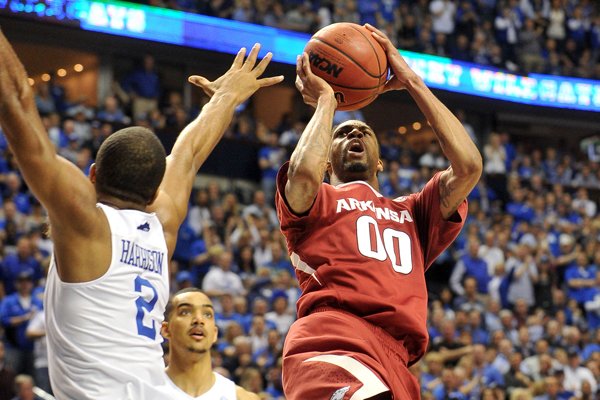 Arkansas guard Rashad Madden pulls up for a jump shot over Kentucky defender Aaron Harrison during the first half of Arkansas' 78-63 loss to No. 1 Kentucky in the 2015 SEC Championship game at Bridgestone Arena on March 15, 2015, in Nashville.