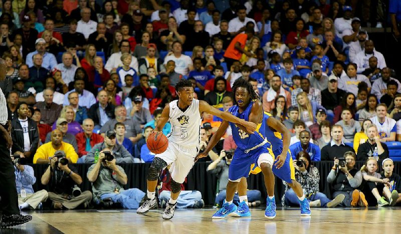 3/14/15
Arkansas Democrat-Gazette/STEPHEN B. THORNTON
Bentonville's Malik Monk, (5) dribbles around North Little Rock's Kambrion Dickerson (12) before a sell out crowd  during the Class 7A Boys State High School Basketball Championships in Hot Springs, Ark. Saturday March 14, 2015.