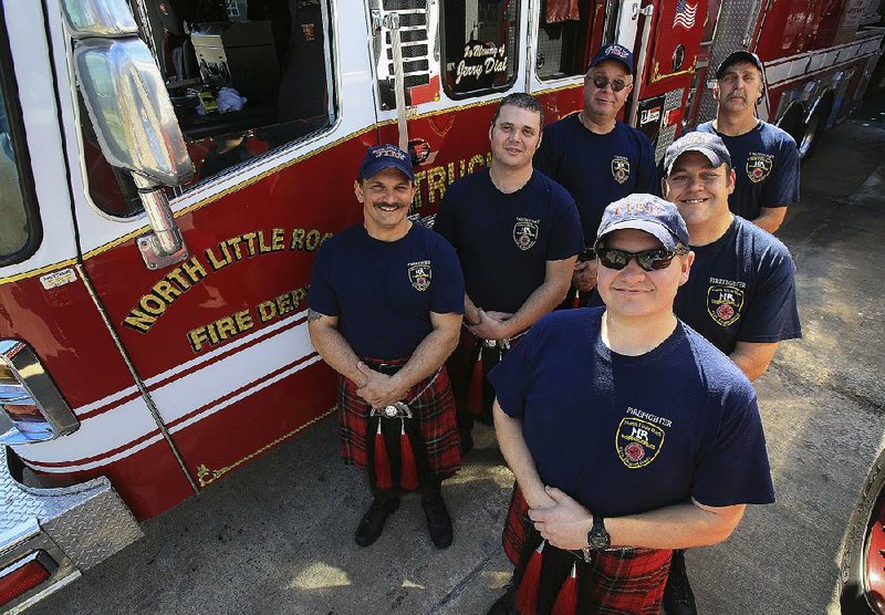 Arkansas Democrat-Gazette/STATON BREIDENTHAL --3/16/15--  Members of the the North Little Rock Fire Department's Pipe and Drum Brigade include (left row front to back) Aaron Henderson, Lt. Josh Cox, Capt. Alan Tetkoskie and (right row front to back)Corey Platt, Sean Walker, Lt. Mark Wittenburg and Charlie Hobson (not pictured).