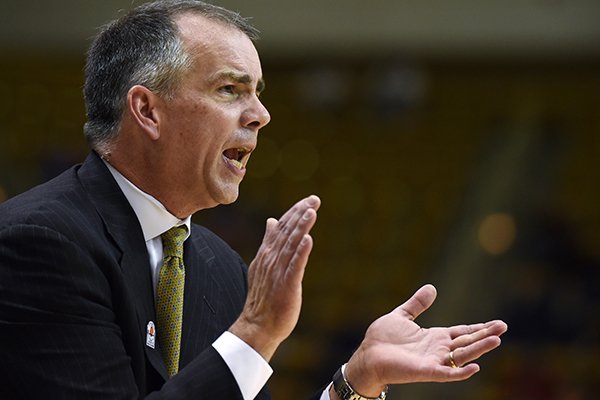 Wofford head coach Mike Young reacts to a play during the first half of an NCAA college basketball game against Furman during the Southern Conference tournament on Monday, March 9, 2015, in Asheville, N.C. Wofford won 67-64. (AP Photo/Rainier Ehrhardt)