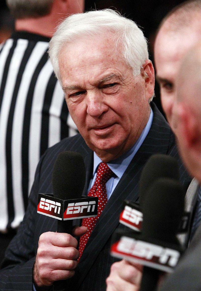 In this March 10, 2012, file photo,†ESPN announcer Bill Raftery works before an NCAA college basketball game in the final between Louisville and Cincinnati at the Big East Conference tournament in New York. Raftery and Grant Hill will call the Final Four this season, taking the place of the suspended Greg Anthony to work alongside play-by-play announcer Jim Nantz, CBS and Turner Sports said Tuesday, Feb. 3, 2015.  