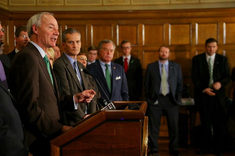 “I’ve been concerned from day one that we’re doing the right thing for the children of Arkansas through our Department of Human Services,” Gov. Asa Hutchinson (left) said Tuesday.