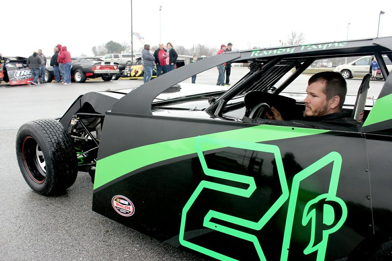 Tina Parker/Herald-Leader Dirt track racer Randy Payne backed his race car into a spot at 2B&#8217;s Auto Sales on Saturday for the Flint Creek Speedway Car Show. Races at the speedway in West Siloam Springs have not begun because of poor weather.