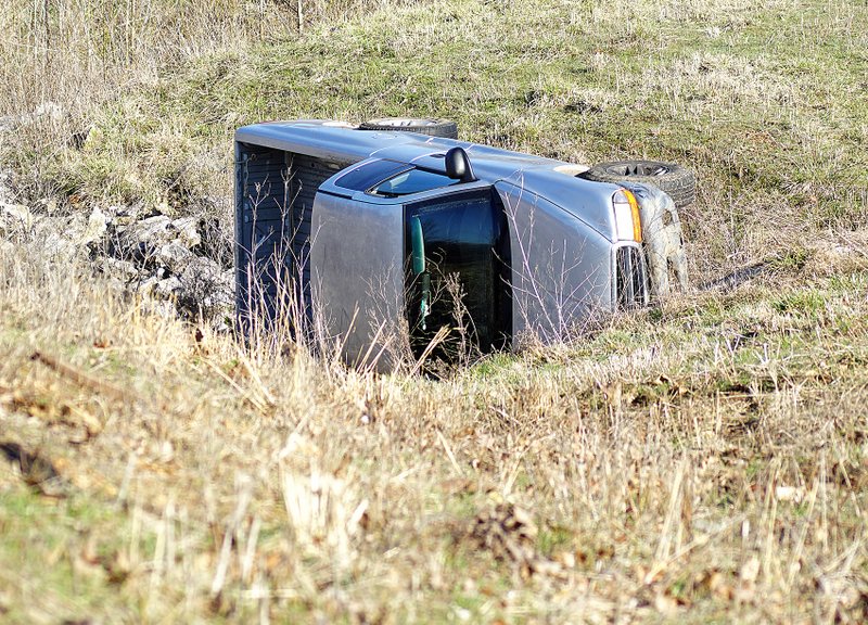 Photo by Randy Moll A Dodge Dakota pickup truck ended up on its side in a drainage culvert which passes under Gentry Blvd. following a single vehicle accident on Monday morning.