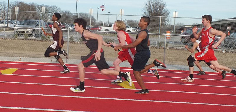 Blackhawk Drew Winn, center, won the overall high point for boys in the track meet hosted by Pea Ridge Monday.