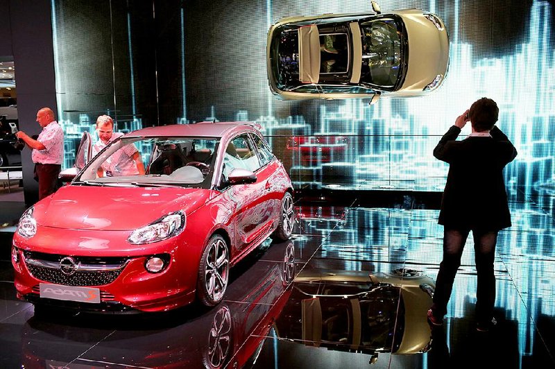 An Opel Adam S automobile is displayed at the Moscow International Auto Salon in Russia in August. General Motors Co. said Wednesday it will stop the sale of its Opel brand and most Chevrolet models in Russia. 
