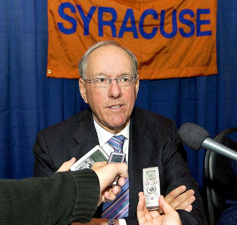 This is an Oct. 24, 2007, file photo showing Syracuse head coach Jim Boeheim speaking to the media during the Big East basketball media day at Madison Square Garden in New York. Syracuse university officials say coach Boeheim will retire in three years and athletic director Daryl Gross has resigned following punishment from the NCAA for violations that lasted more than a decade.  