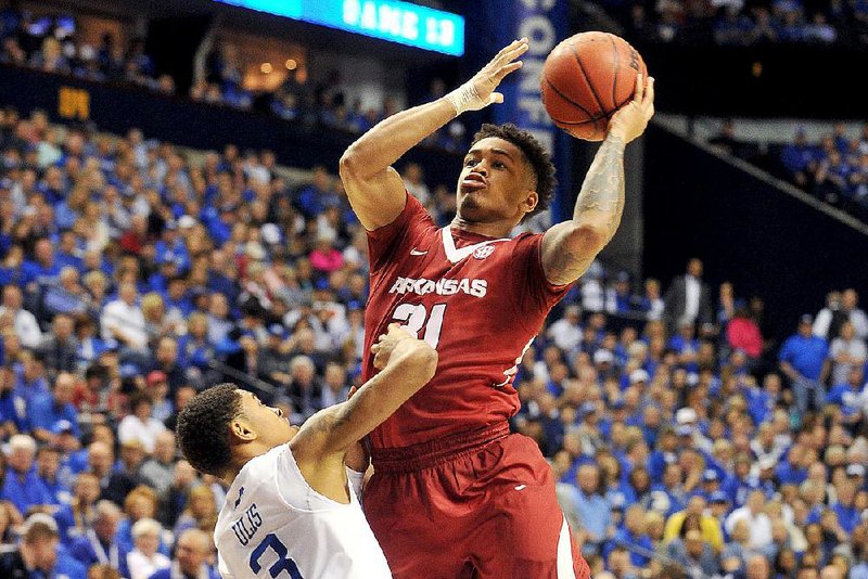 University of Arkansas guard Anton Beard drives to the hoop past Kentucky defender Tyler Ulis during the second half of Arkansas' 78-63 loss to the Kentucky Wildcats in the Sundays Championship game in the 2015 SEC basketball tournament at Bridgestone Arena in Nashville.