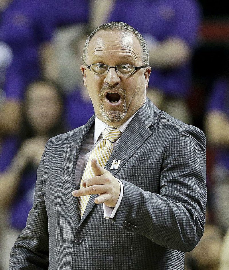 Washington head coach Mike Neighbors in action against California in an NCAA college basketball game in the quarterfinals of the Pac-12 Conference tournament Friday, March 6, 2015, in Seattle. Cal won 69-53. 