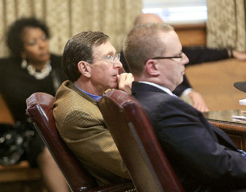 State Board of Education Chairman Sam Ledbetter (middle) along with Arkansas Department of Education attorney Jeremy Lasiter (right) and former Little Rock School Board member Dianne Curry (left) listen to testimony Thursday morning during a hearing at the Pulaski County Courthouse on a lawsuit challenging the state's decision to take over the Little Rock School District. 
