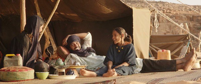 Satima (Toulou Kiki), Kidane (Ibrahim Ahmed) and their daughter Toya (Layla Walet Mohamed) are nomadic cattle herders living a seemingly idyllic existence in the Sahara in Abderrahmane Sissako’s Timbuktu.