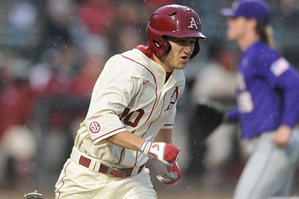 Arkansas outfielder Joe Serrano runs to first base after an RBI single during a game against LSU on Thursday, March 19, 2015, at Baum Stadium in Fayetteville. 