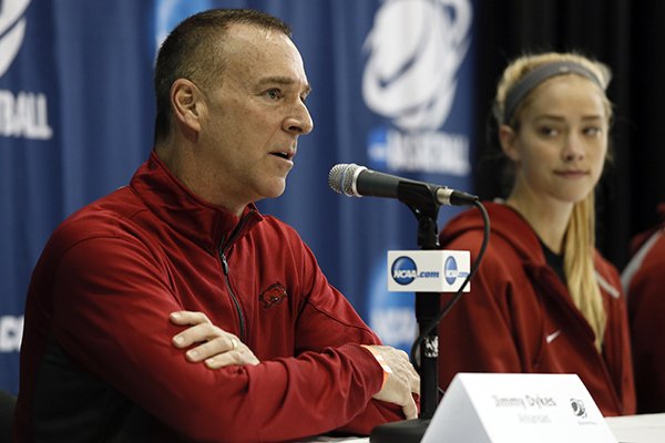 Arkansas head coach Jimmy Dykes responds to a question as Calli Berna, right, watches during a news conference for the first round of the NCAA women's college basketball tournament Thursday, March 19, 2015, in Waco, Texas. Arkansas plays Northwestern on Friday. (AP Photo/Tony Gutierrez)