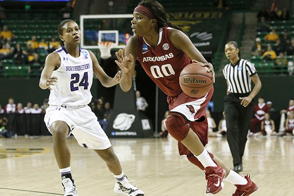 Northwestern's Christen Inman (24) defends against a drive by Arkansas' Jessica Jackson (00) in the first half of a women's college basketball game in the first round of the NCAA tournament, Friday, March 20, 2015, in Waco, Texas. (AP Photo/Tony Gutierrez)