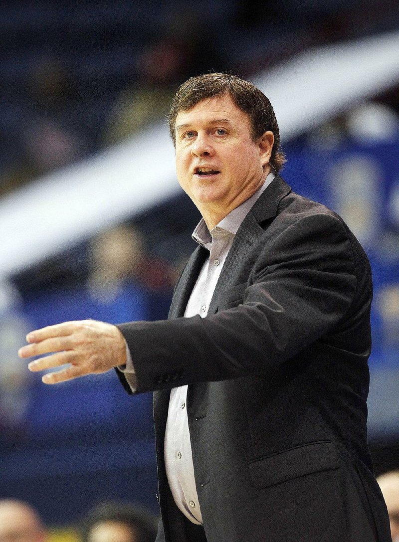 Arkansas Little Rock head coach Joe Foley talks to his team in the first half of an NCAA college basketball game against Arkansas State in the championship of the Sunbelt Conference tournament in New Orleans, Saturday, March 14, 2015. (AP Photo/Bill Haber)