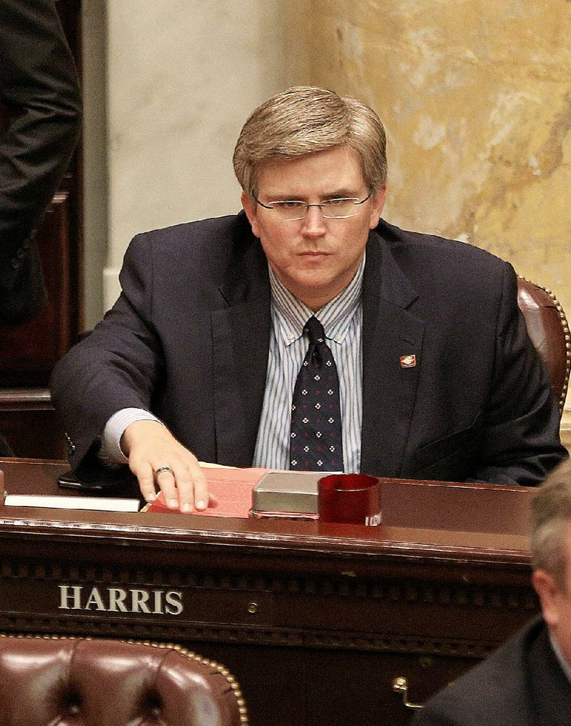 Arkansas Democrat-Gazette/STATON BREIDENTHAL --3/20/15--  Rep. Justin Harris, R-West Fork, votes on a bill in the House chamber Friday at the state Capitol that would prohibit the re-homing of an adopted child. Harris voted "yes" on the bill.