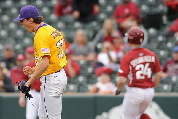 Closer Jesse Stallings (left) of LSU celebrates the final out of the game against Arkansas Saturday, March 21, 2015, at Baum Stadium in Fayetteville.
