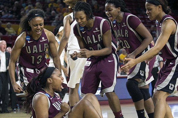 UALR's Kaitlyn Pratt (40) reacts after drawing a charge against Texas A&M during the first half of a women's first round NCAA tournament college basketball game, Saturday, March 21, 2015, Tempe, Ariz. (AP Photo/The Arizona Republic, Patrick Breen) 