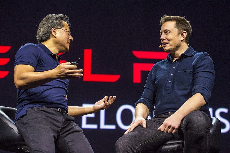 Jen-Hsun Huang, chief executive officer of Nvidia Corp., left, speaks with Elon Musk, co-founder and chief executive officer of Tesla Motors Inc., during the GPU Technology Conference (GTC) in San Jose, California, U.S., on Tuesday, March 17, 2015. Musk said that weíll ìtake autonomous cars for grantedî in a short period of time and signaled that the automaker plans to be a leader in the nascent market. Photographer: David Paul Morris/Bloomberg *** Local Caption *** Jen-Hsun Huang; Elon Musk