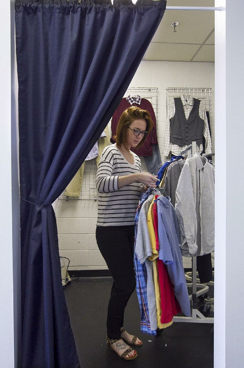 Arkansas Democrat-Gazette/BENJAMIN KRAIN --3/17/15--
Stylist Amber Taylor puts together outfits for clients of her and David Allan's internet startup Tagless Style. The company is partnering with Goodwill Industries in Little Rock to have first pick of donated clothing to offer stylized wardrobes for it's clients.