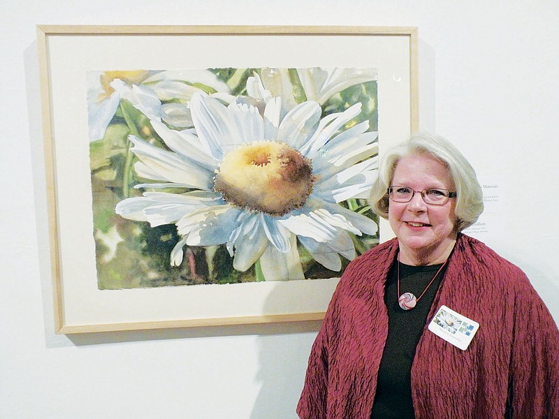 Marlene Gremillion of Hot Springs Village won the Arkansas Artist’s Materials Award in the Mid-Southern Watercolorists’ 45th annual juried exhibition currently on display at the Arkansas Arts Center in Little Rock. Gremillion is shown here with her winning painting, The Dominant One.
