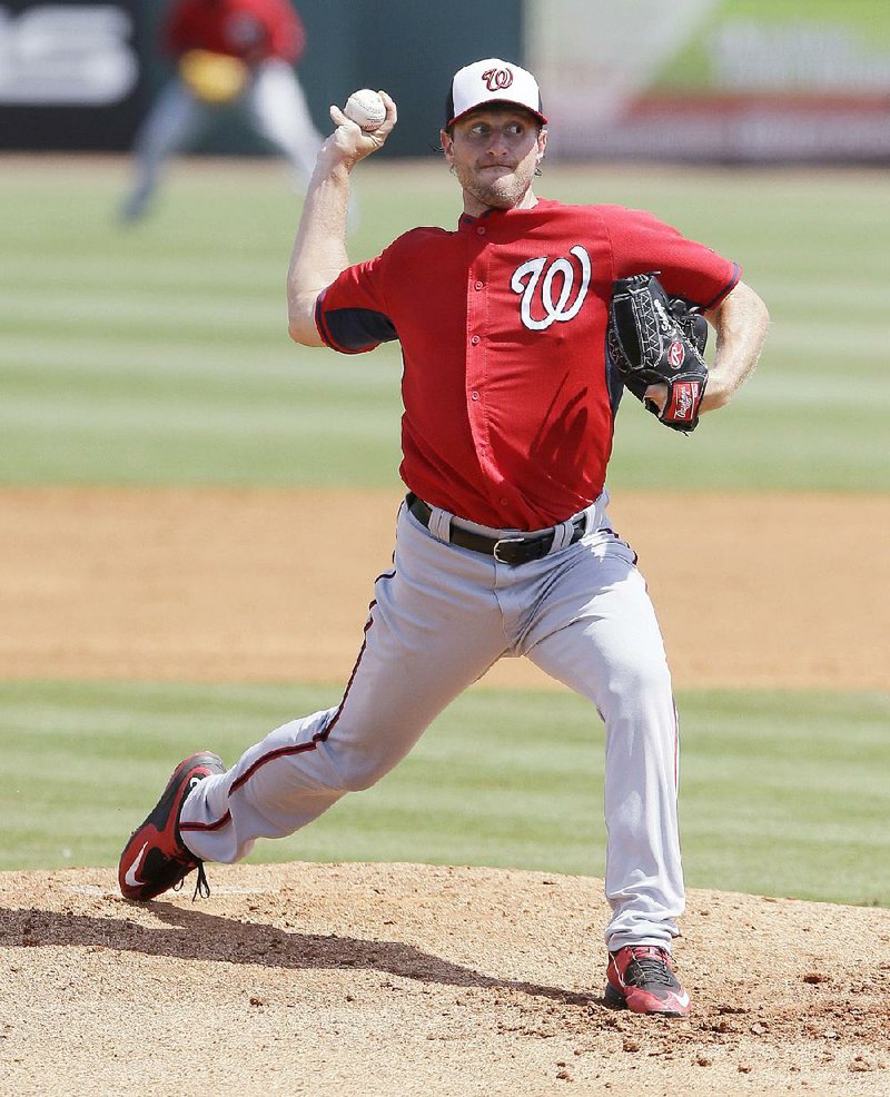 Washington Nationals starting pitcher Max Scherzer throws during the third inning of a spring training exhibition baseball game against the Houston Astros in Kissimmee, Fla., Sunday, March 15, 2015. (AP Photo/Carlos Osorio)