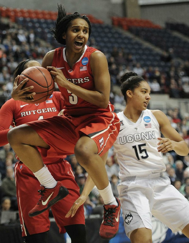 Rutgers’ Tyler Scaife, pulls down a defensive rebound against Connecticut’s Gabby Williams, right, during the first half of a college basketball game in the second round of the NCAA tournament Monday, March 23, 2015, in Storrs, Conn. (AP Photo/Jessica Hill)