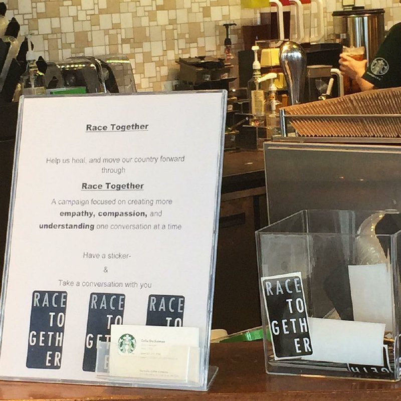 Arkansas Democrat-Gazette/JENNIFER CHRISTMAN

A sign announcing Starbucks' Race Together campaign and a bin of stickers sits on the counter at the coffee chain's downtown Little Rock location, 917 S. Broadway St., Little Rock.