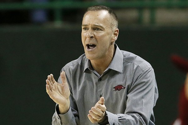 Arkansas head coach Jimmy Dykes cheers on his team during a women's college basketball game against Northwestern in the first round of the NCAA tournament Friday, March 20, 2015, in Waco, Texas. (AP Photo/Tony Gutierrez)