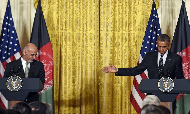 Afghan President Ashraf Ghani and President Barack Obama hold a news conference Tuesday at the White House where Obama said he was slowing the withdrawal of troops from Afghanistan at Ghani’s request. “Afghanistan remains a very dangerous place,” Obama said.