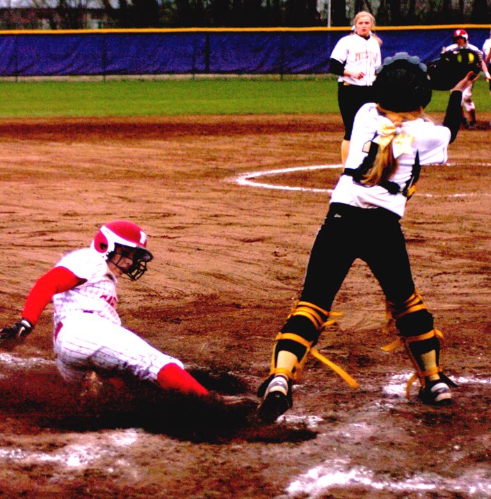 MARK HUMPHREY ENTERPRISE-LEADER Brooke Larkin slides in to score against Pottsville. Farmington placed third in tournament action last weekend.