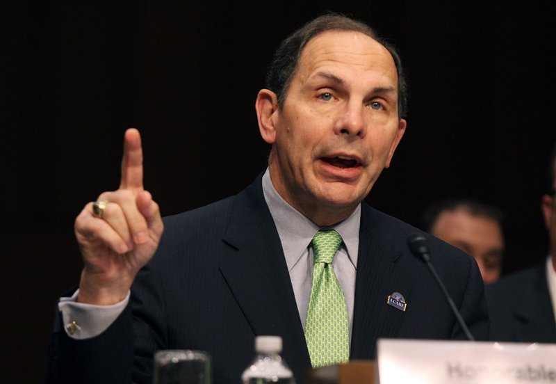 In this Sept. 9, 2014, file photo, Veterans Affairs Secretary Robert McDonald testifies on Capitol Hill in Washington. Responding to pressure from Congress and veterans groups, the Department of Veterans Affairs is relaxing a rule that makes it hard for some veterans in rural areas to prove they live at least 40 miles from a VA health site. "We've determined that changing the distance calculation will help ensure more veterans have access to care when and where they want it," McDonald said in a statement. 