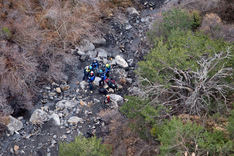 Searching the wreckage: Rescue workers on Wednesday investigate on the crash site of a plane on a flight from Barcelona, Spain to Duesseldorf, Germany near Seyne-les-Alpes, French Alps. 