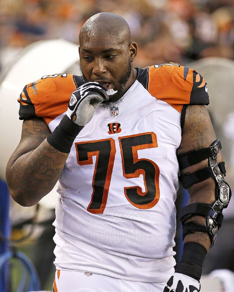 This photo made Aug. 16, 2014, shows Cincinnati Bengals defensive tackle Devon Still on the sidelines during an NFL preseason football game against the New York Jets in Cincinnati. Still is grateful to be on the Bengals' practice squad, which allows him to keep his medical insurance. His 4-year-old daughter is fighting cancer.