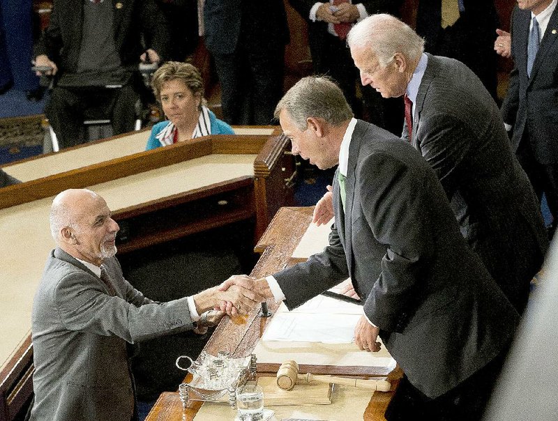 Afghan President Ashraf Ghani thanks House Speaker John Boehner and Vice President Joe Biden after speaking Wednesday before a joint session of Congress.