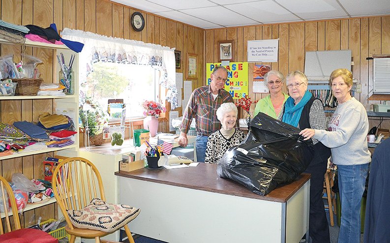 From left, the Rev. Wayne Wood, Gaye Wood, Sharon Sanders, Katherine Owens and Kathie Mitchell are volunteers at the Christian Service Center in the Pineville community. The center donates proceeds from its thrift store to various nonprofit organizations that assist people in need.