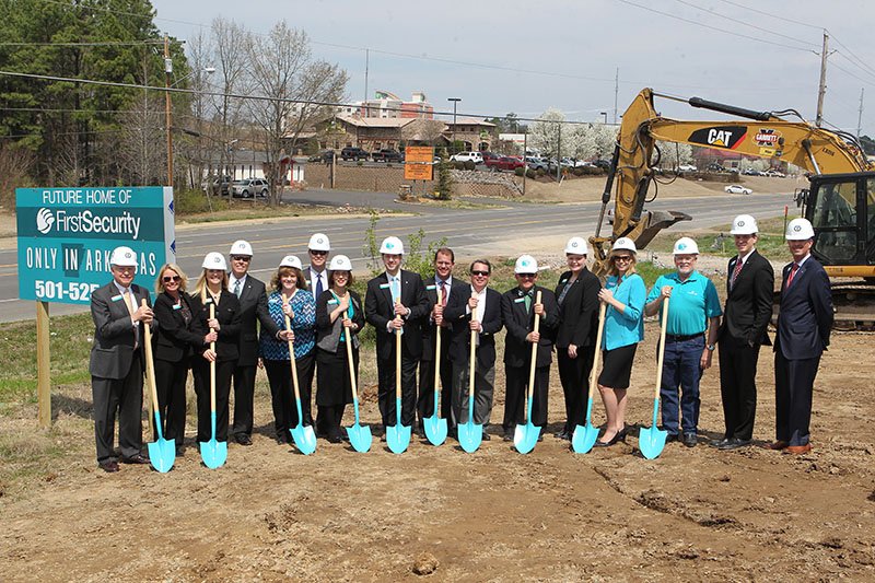 The Sentinel-Record/Richard Rasmussen GROUNDBREAKING: First Security Bank officers and employees, along with officials with CEI Contractors, break ground Wednesday at 4129 Central Ave., the site for the bank's Hot Springs headquarters.
