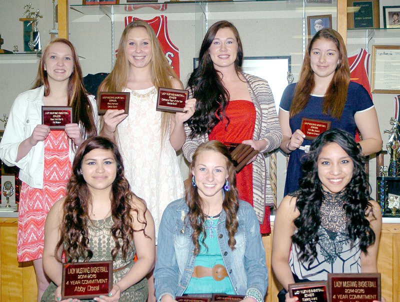 RICK PECK MCDONALD COUNTY PRESS Members of the McDonald County High School girls basketball team were presented awards at banquet held Monday night at MCHS. Front row, left to right: Abbey Dozal, Coley Ickes and Cendy Garcia. Back row: Baili Nelson, Dakota Bunch, Preslea Reece and Cheyenne Greenup.