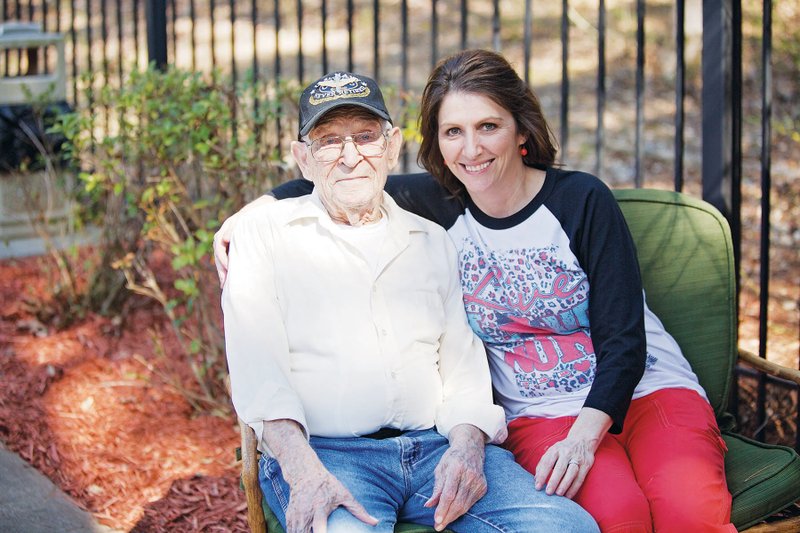 World War II veteran Charles Thurman Nix sits with his granddaughter Krista Thompson, who works at the Perry County Nursing and Rehabilitation Center in Perryville, where he lives. “It’s wonderful,” Thompson said of getting to work in the same facility. Nix and his wife, who died in October, raised three daughters and a son. He also has one surviving sibling, a 96-year-old sister. Nix will receive an honorary high school diploma Wednesday from the Perryville School District.