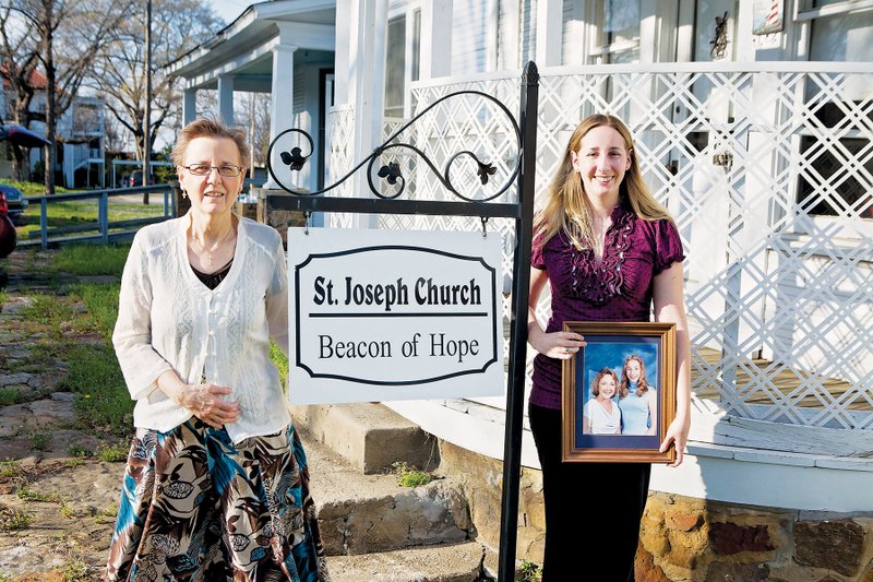 Kathy Kordsmeier, left, coordinator of Beacon of Hope Ministry through St. Joseph Catholic Church in Conway, stands with Aprille Hanson, a volunteer. Hanson holds a photograph of her and her mother. Hanson’s mother died in March 2012 just days after her 47th birthday. Hanson found solace in the grief ministry and through one-on-one counseling sessions with Kordsmeier. The ministry is open to all, regardless of their religious affiliation, the women said.