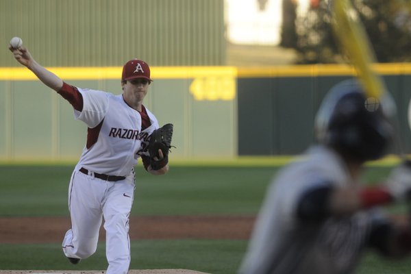 Arkansas' Dominic Taccolini delivers a pitch against Ole Miss Thursday March 26, 2015 at Baum Stadium in Fayetteville.