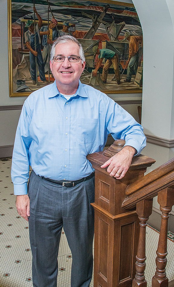 Saline County Judge Jeff Arey stands in the stairwell of the Saline County Courthouse in Benton. As chief executive officer of Saline County, Arey maintains an office on the first floor of the historic courthouse, which was built in 1902.