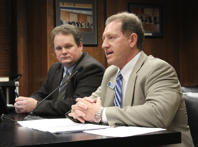 Tony Prothro, executive director of the Arkansas School Boards Association, speaks against House Bill 1984 Thursday while the bill's sponsor, Rep. Nate Bell, R-Mena, looks on.